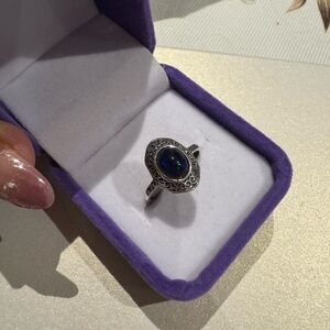 Black opal ring on silver 925 setting

Adjustable